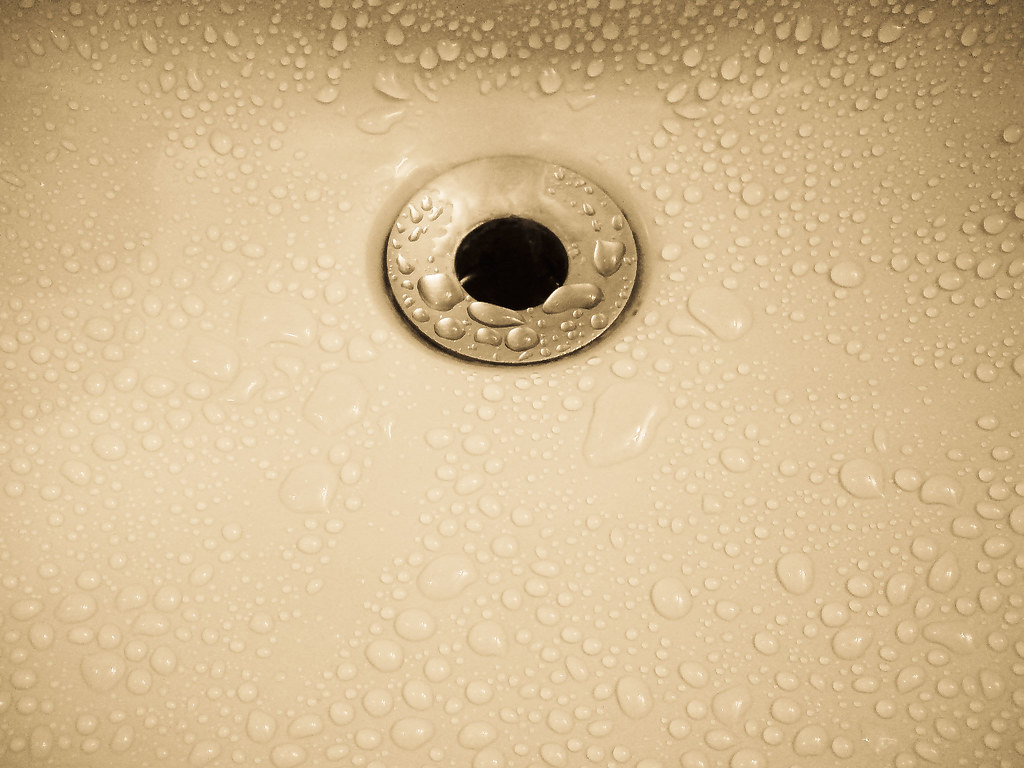 Close-up of a bathroom sink and drain